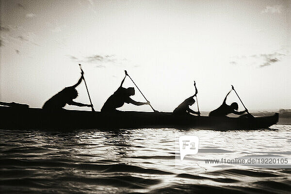 Hawaii  Molokai To Oahu Canoe Race  Paddlers Silhouetted At Sunset (Black And White Photograph).