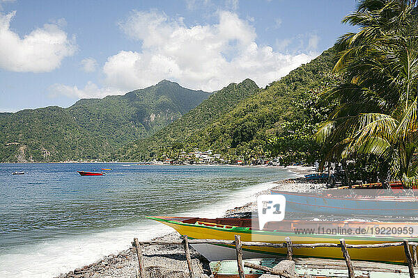 Coastal  scenic view of traditional dugout fishing boats beached along the shore of the small village of Scotts Head in Soufriere Bay on the Island of Dominica; Soufriere  Dominica  Caribbean