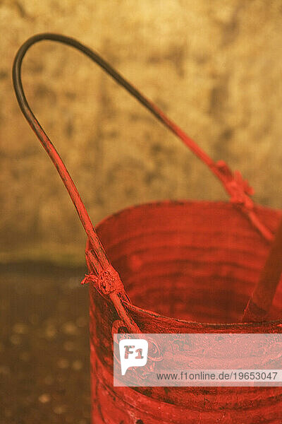 Red paint bucket.