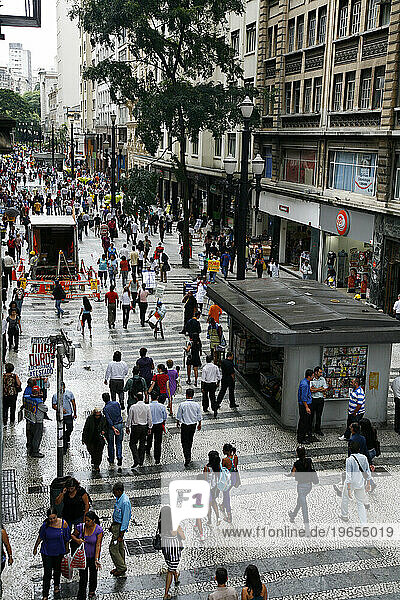 People walking on a shopping pedestrian street in central Sao Paulo  Brazil.