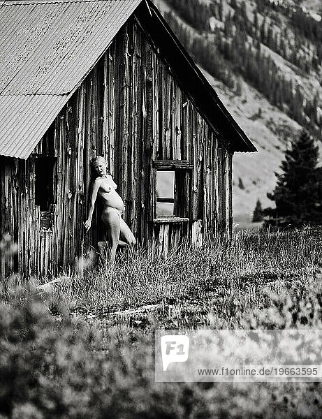 Photo of a naked woman six months pregnant in ghost town  Colorado.