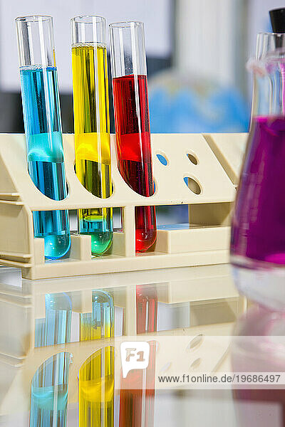 Test tubes and flask with colorful fluids