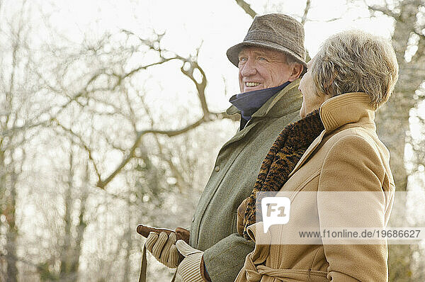 Mature couple walking in the park