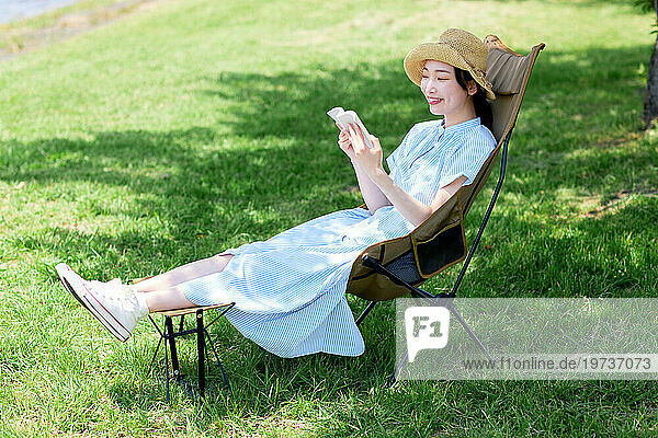 Young Japanese woman relaxing outside