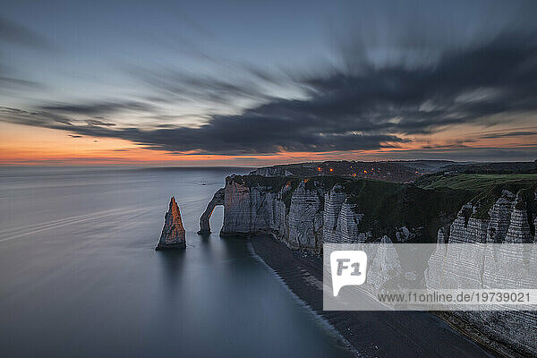 France  Normandy  Long exposure of Falaise dAval and Aiguille dEtretat rock formation at dawn