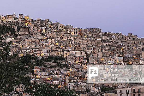 Italy  Sicily  Modica  Hillside houses at dusk