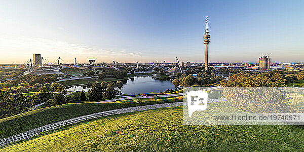 Germany  Bavaria  Munich  Panoramic view of Olympic Park with Olympic Tower  BMW Building and pond in background