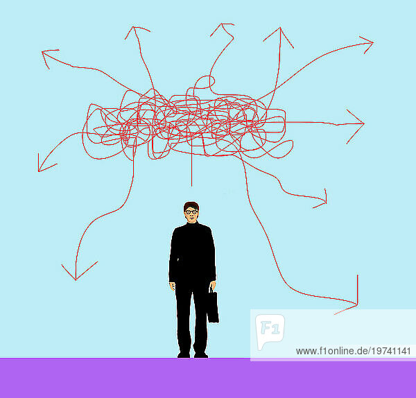 Businessman standing under tangled arrows against blue background