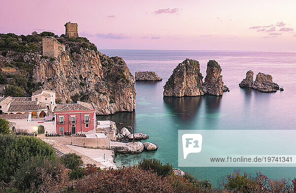 Italy  Sicily  Scopello  Coastal village and Tonnara di Scopello stack rocks at dusk