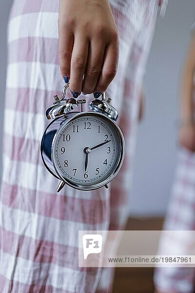 Topic: Young woman  Girl  Old-fashioned alarm clock