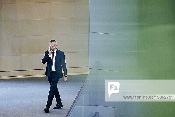 Volker Wissing (FDP)  Federal Minister for Transport and Digital Affairs  on the phone in the Bundestag plenary. Berlin  28 November 2023