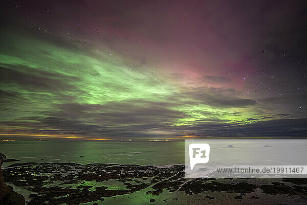 UK  Scotland  Dunbar  Long exposure of Aurora Borealis over Firth of Forth at night