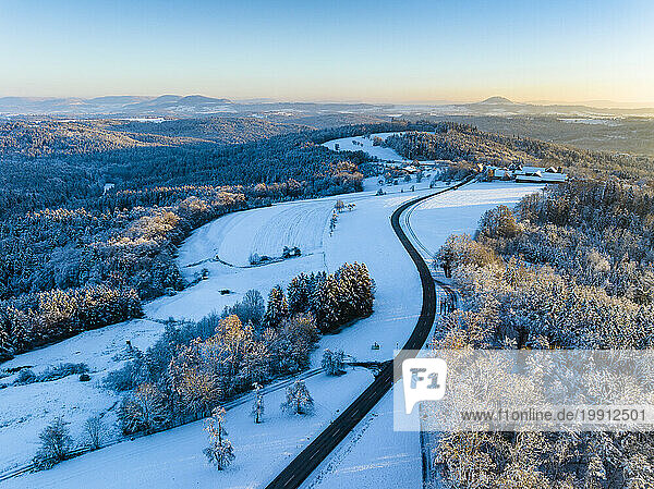 Germany  Baden-Wurttemberg  Aerial view of road in snow-covered Remstal valley