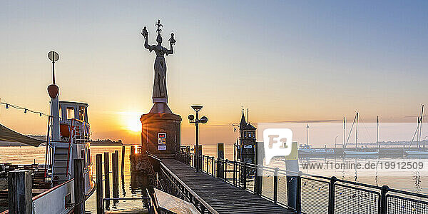 Germany  Baden-Wurttemberg  Konstanz  Panoramic view of harbor on shore of Bodensee at sunrise