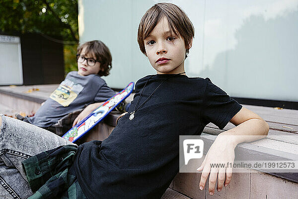 Brothers sitting on steps together