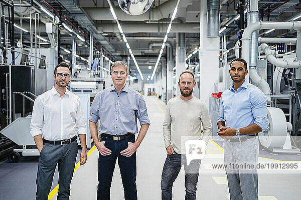 Portrait of confident staff in a factory