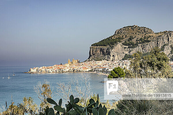 Italy  Sicily  Cefalu  Coastal town with cliffs in background