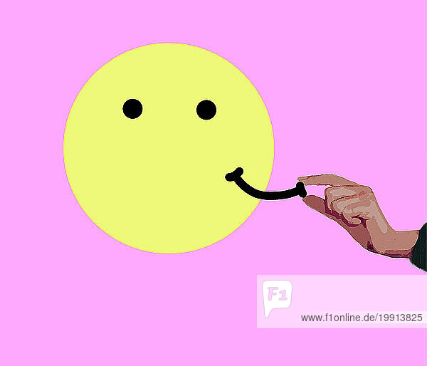Hand placing or removing smile on anthropomorphic smiley face