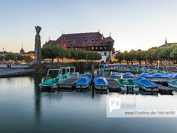 Germany  Baden-Wurttemberg  Konstanz  Pedal boats moored in harbor on shore of Bodensee at dusk
