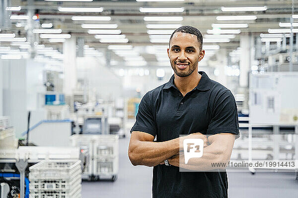 Portrait of a confident employee in a factory