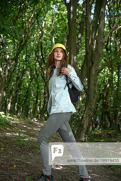 Cheerful Young woman walking in a forest on a sunny day  Ukraine