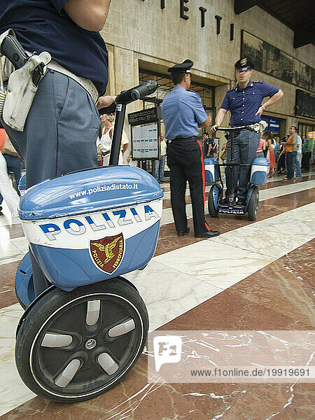 Italian policemen using motorized scooters