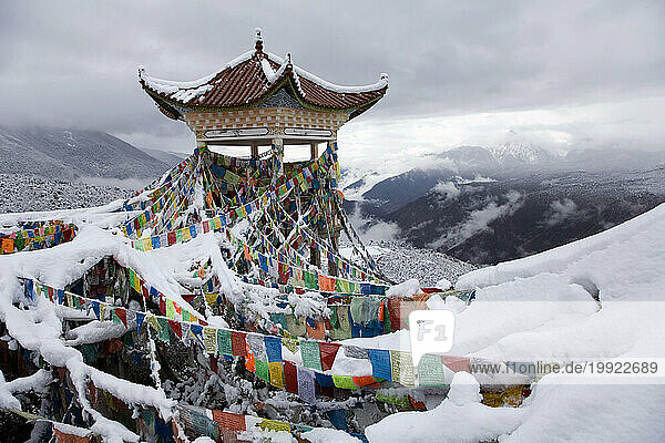 Prayer flags in the snow in Yunnan Province  China.