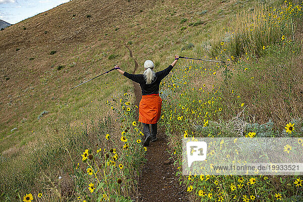 USA  Idaho  Hailey  Senior woman hiking Carbonate Mountain trail