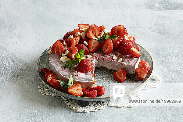 Studio shot of ready-to-eat vegan strawberry tart