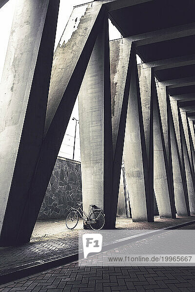 Bicycle near architectural columns