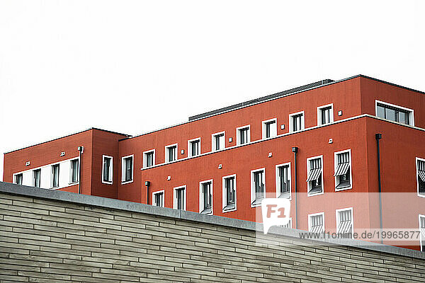 Germany  Baden-Wurttemberg  Freiburg im Breisgau  Modern red painted apartment building