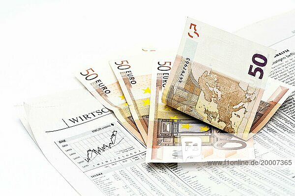 Stock market price in a newspaper and 4 banknotes