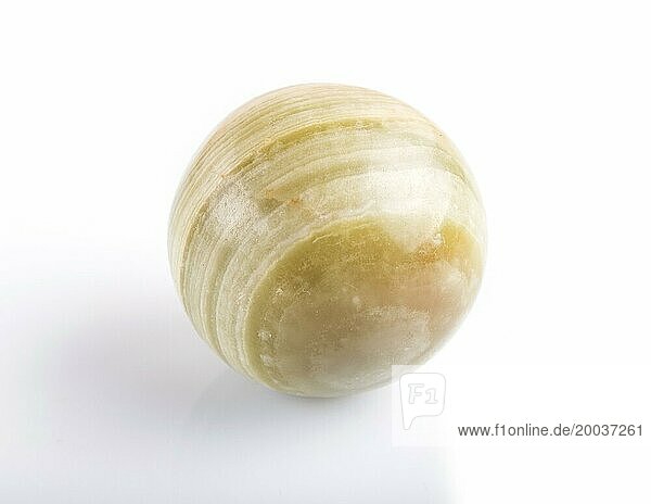 Green onyx sphere isolated on white background  close up