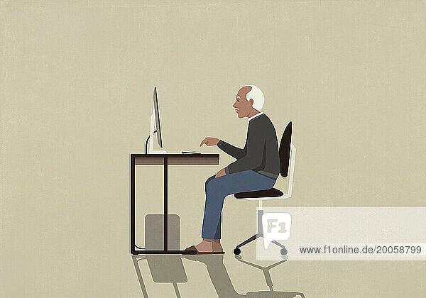 Senior man using computer at desk