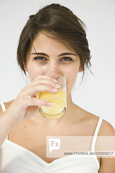 Woman Drinking Orange Juice
