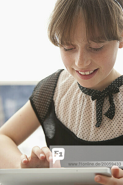 Young Girl Using Tablet PC