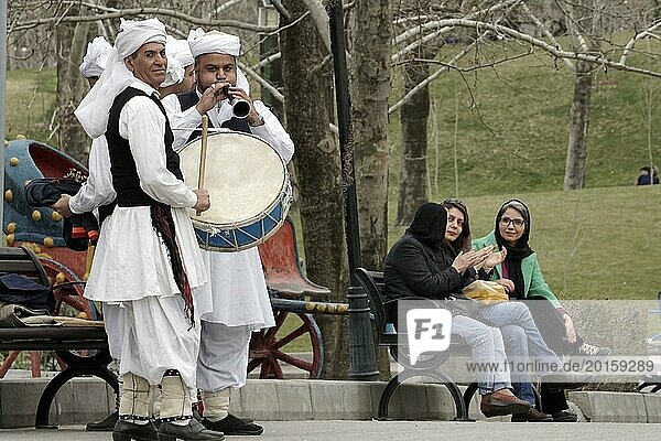 Musicians in traditional dress play music in a park in Tehran  Iran  woman  14.03.2019  Asia