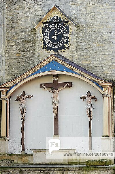 Crucifixion group and clock at St John's Church  Billerbeck  Münsterland  North Rhine-Westphalia  Germany  Europe