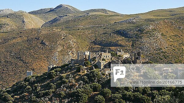 Old buildings of a village embedded in the hilly landscape under a clear blue sky  Vathia  residential tower village  Mani peninsula  Peloponnese  Greece  Europe