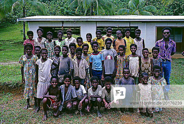 Papua New Guinea. Sepik region. School children posing with their teachers.