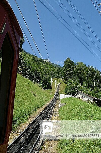 One of Switzerland main tourist attraction: Travelling with the world strongest rise cog railway driving up mount Pilatus at Lake Lucerne