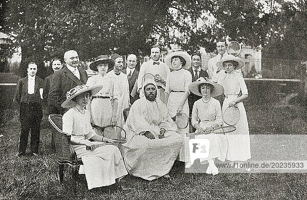 Abdelhafid of Morocco  Moulay Abdelhafid  1875 -1937. Sultan of Morocco from 1908 to 1912 and a member of the Alaouite Dynasty. Seen here with a group of young ladies who had been playing tennis at Versailles. From Mundo Grafico  published 1912.
