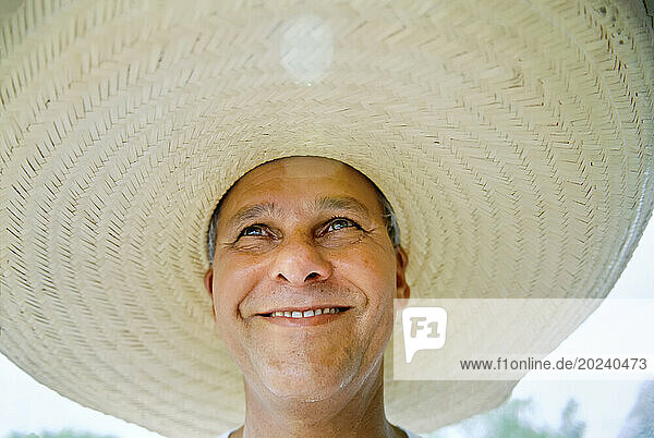Brazilian man wearing a large brimmed hat; Pantanal Region  Brazil