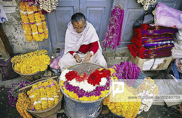 Street vendor sells flowers in Kathmandu; Kathmandu  Nepal