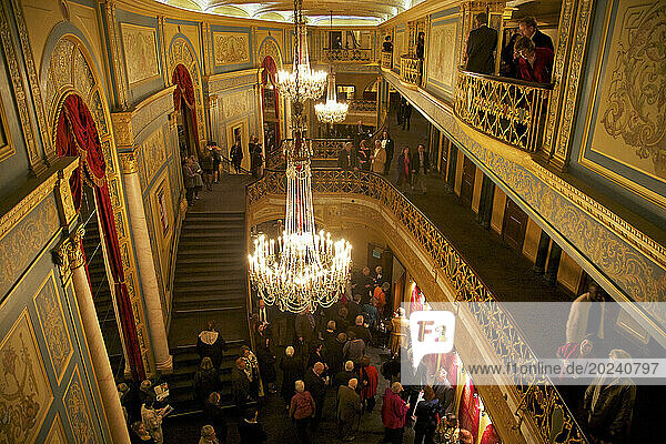 People inside the historic Opera House in Detroit which premiered in 1922  claiming to be the world's fifth largest; Detroit  Michigan  United States of America
