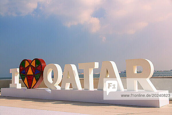 I love Qatar sign on a walkway along the coast; Qatar