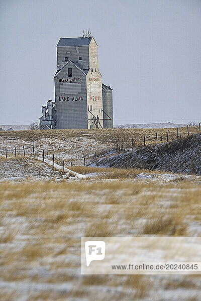 Lake Alma grain elevator standing lonely against a wintery landscape  Saskatchewan; Lake Alma  Saskatchewan  Canada