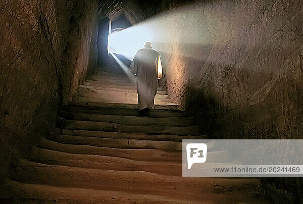 Man ascends stairs in the tomb of Piankhy  a Nubian king; Al Kurru  Sudan