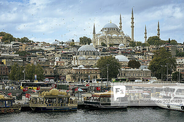 Bosphorus boats and Suleymaniye Mosque on top of the hill; Istanbul  Turkey