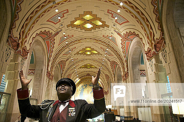 Building doorman admires a vaulted Art Deco ceiling; Detroit  Michigan  United States of America